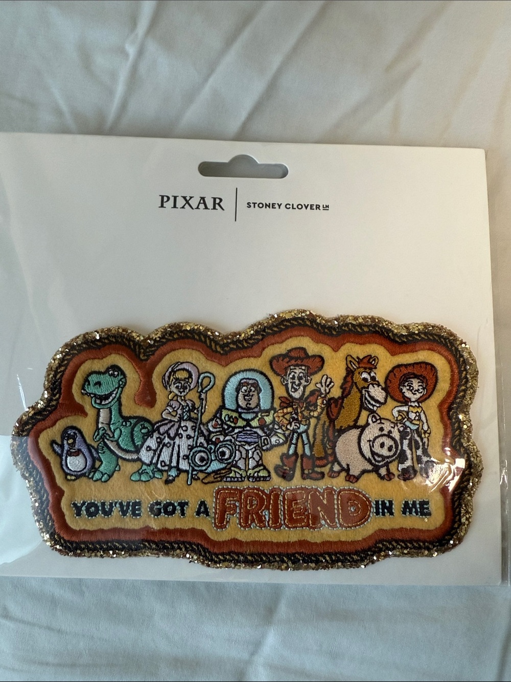 Pixar Toy Story Embroidered 'You've Got A Friend In Me' Patch - Yellow/Orange